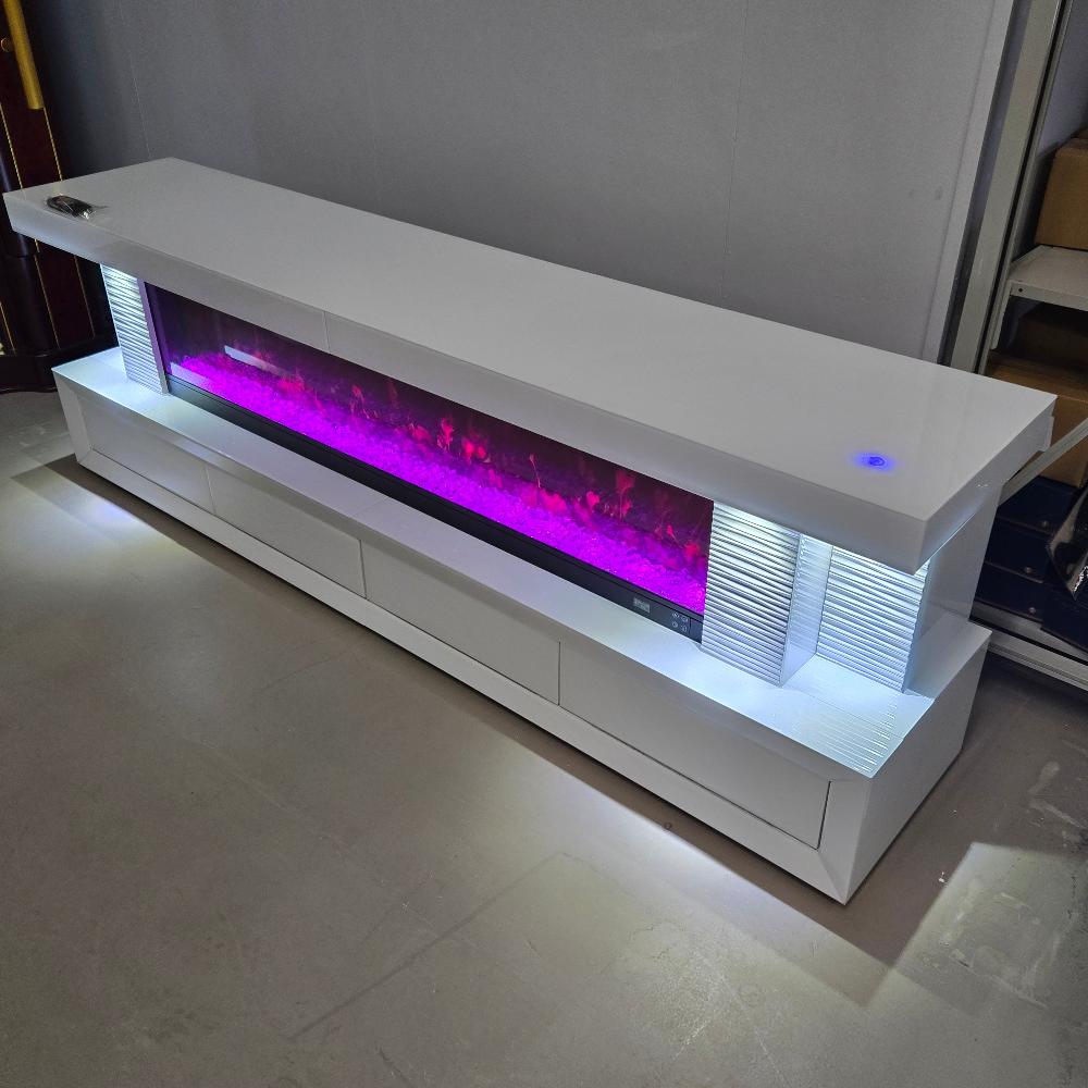 An Exclusive White Glass and MDF TV Stand/Unit with a Stylish look. This Sleek Fireplace Reflector comes with 13 Colour Changes, Bluetooth Speakers, a Touch Screen, and a Remote for Seamless Operation