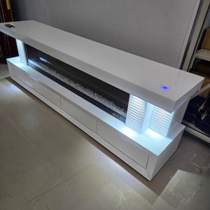 An Exclusive White Glass and MDF TV Stand/Unit with a Stylish look. This Sleek Fireplace Reflector comes with 13 Colour Changes, Bluetooth Speakers, a Touch Screen, and a Remote for Seamless Operation