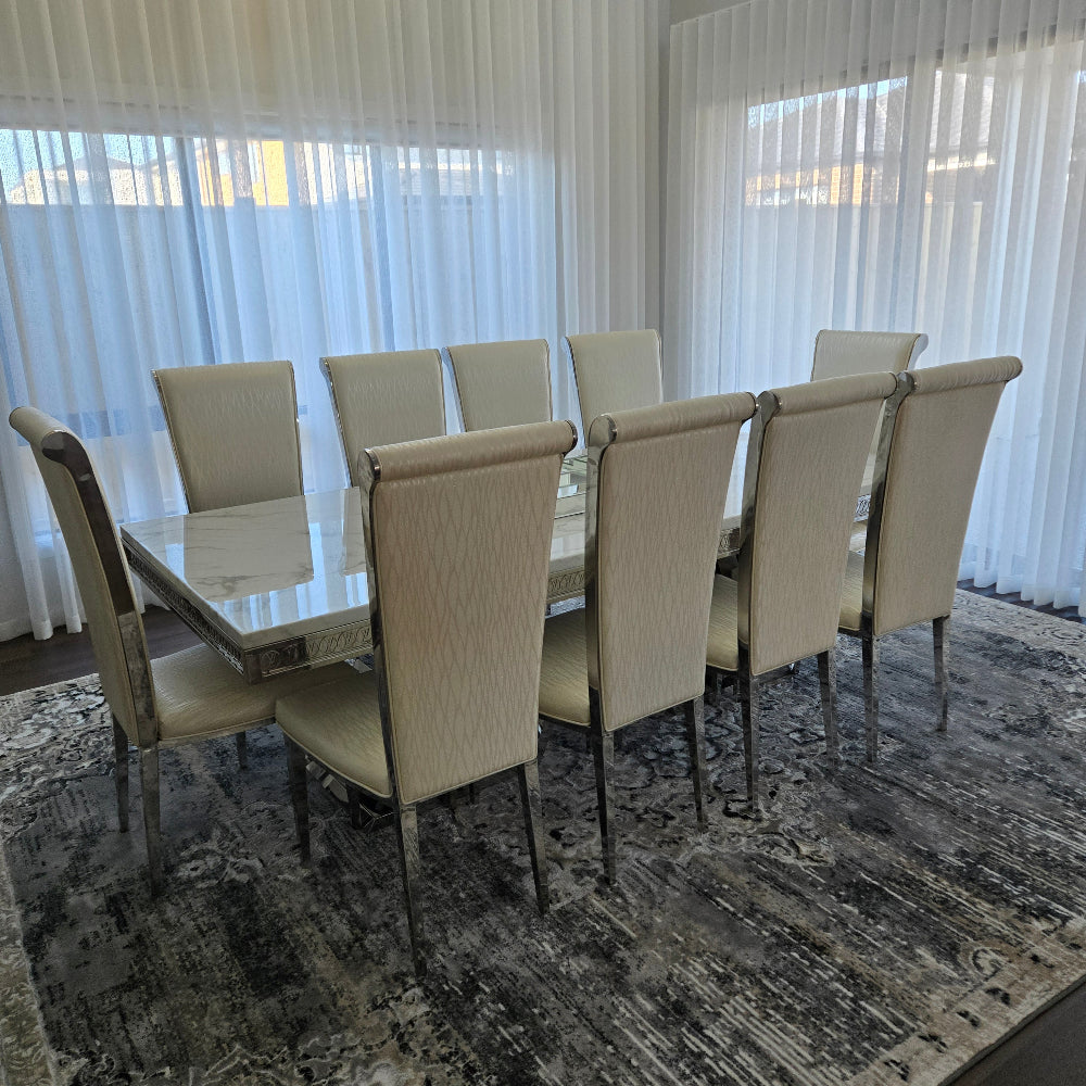 Elegant and Classy LV Marble Dining Table With Circle Grey Velvet Dining Room Chairs with Silver Stainless Steel Frame. Best Dining Table and Chairs