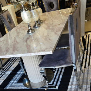 Silver Exclusive Marble Dining Table with 8 Circle Grey Velvet Chairs. RBM Classic Home a family owned furniture with best marble dining table sets