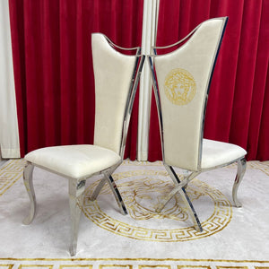 Round Marble Dining Table With Cream Velvet Classy Dining Room Chairs in Silver Stainless Steel Frame